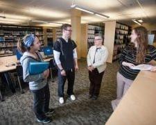 Students talking with the Bellin College librarian.
